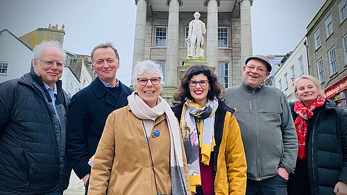Marc Davy with Layla Moran and St Ives Liberal Democrats in front of the Humphrey Davey statue in Penzance
